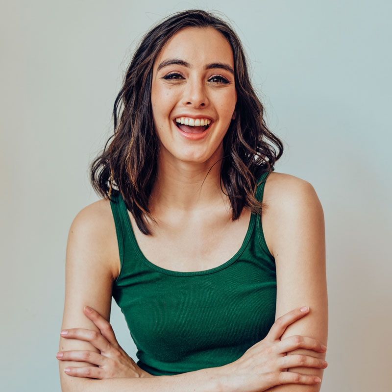 woman smiling with arms crossed