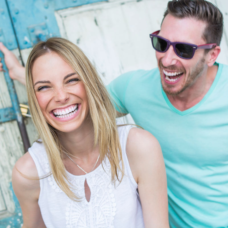 man and woman laughing